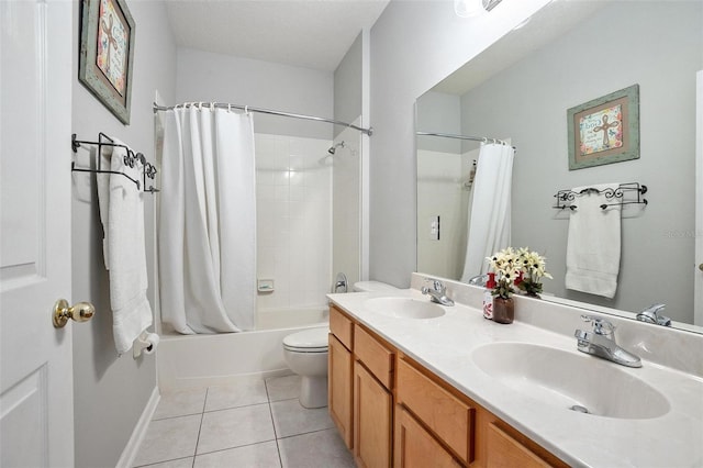 full bathroom featuring dual bowl vanity, toilet, tile floors, shower / bath combo with shower curtain, and a textured ceiling