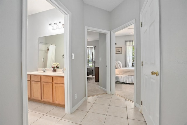 bathroom featuring tile flooring and vanity