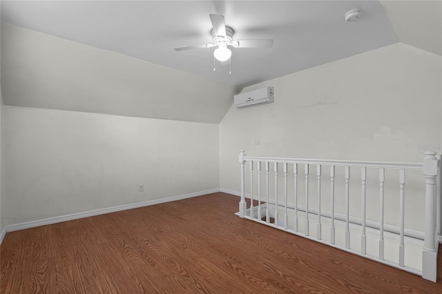 additional living space featuring a wall mounted air conditioner, ceiling fan, lofted ceiling, and hardwood / wood-style floors