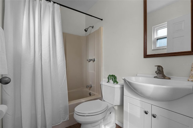 full bathroom with shower / tub combo with curtain, vanity, and toilet