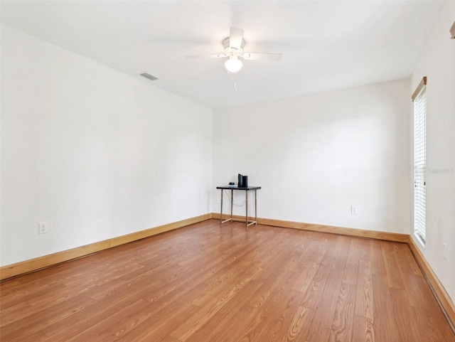 unfurnished room featuring ceiling fan and light wood-type flooring