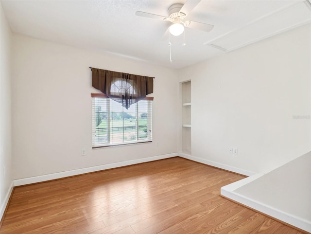 spare room with light hardwood / wood-style flooring and ceiling fan