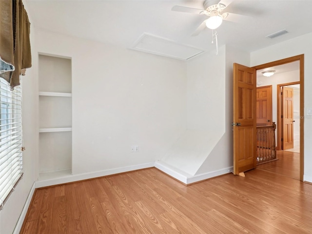 unfurnished room with ceiling fan and light hardwood / wood-style flooring