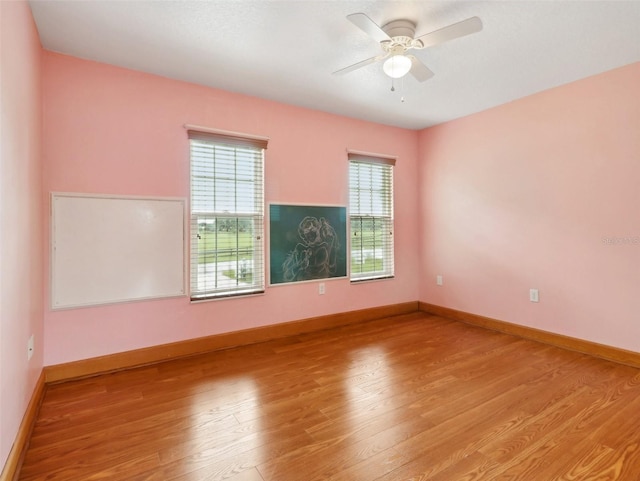 empty room featuring light hardwood / wood-style floors and ceiling fan