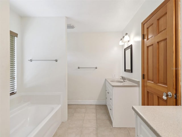 bathroom featuring vanity and a bath