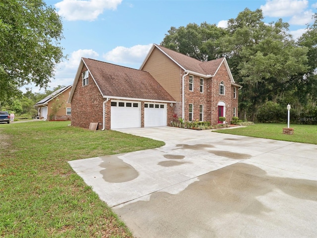 view of front facade featuring a garage and a front lawn