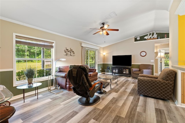 living room with crown molding, plenty of natural light, light wood-type flooring, and ceiling fan