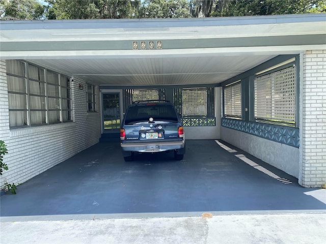 view of vehicle parking featuring a carport