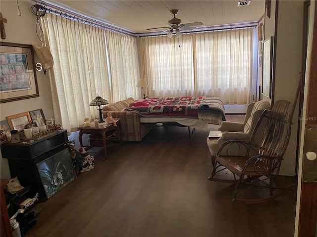 living area with wood-type flooring, ceiling fan, and wood ceiling