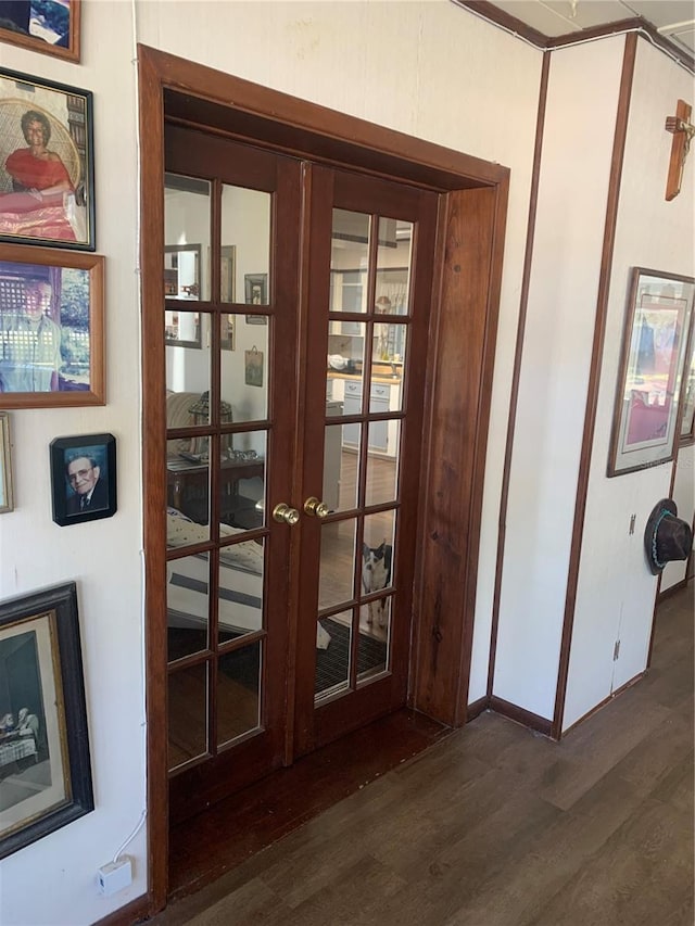 doorway to outside with dark hardwood / wood-style flooring and french doors