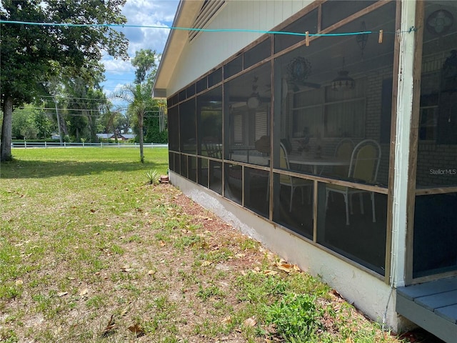 view of yard featuring a sunroom