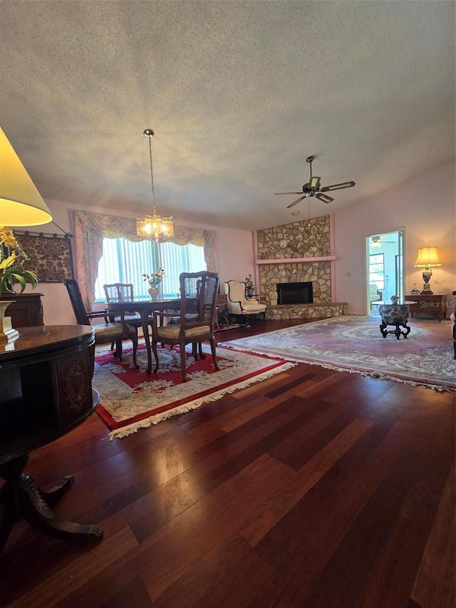 dining area featuring a healthy amount of sunlight, hardwood / wood-style flooring, and a textured ceiling