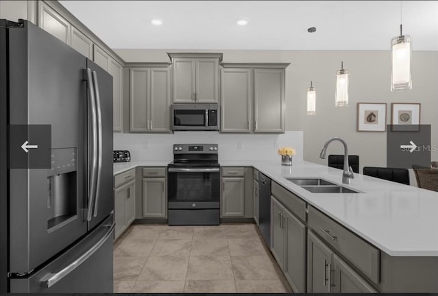 505 Ocean Course Ave Unit 505, Davenport, FL 33896 - kitchen featuring appliances with stainless steel finishes, gray cabinetry, a sink, a peninsula, and recessed lighting