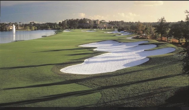 505 Ocean Course Ave Unit 505, Davenport, FL 33896 - surrounding community featuring a water view, view of golf course, and a lawn
