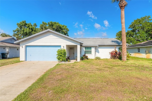 ranch-style home featuring a garage and a front lawn