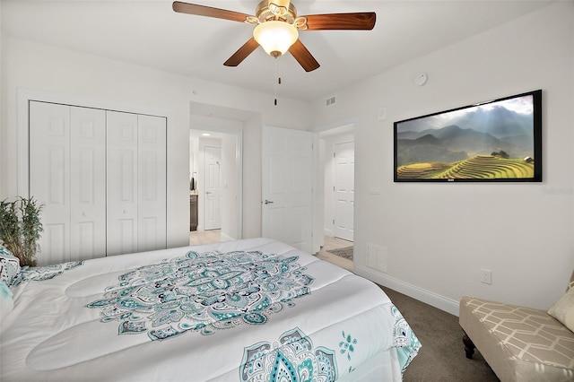 carpeted bedroom featuring a closet and ceiling fan