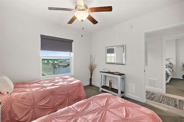 carpeted bedroom with ceiling fan