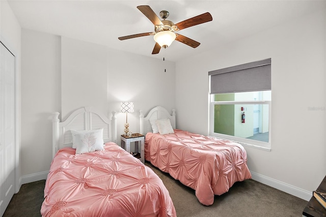 bedroom featuring dark colored carpet and ceiling fan