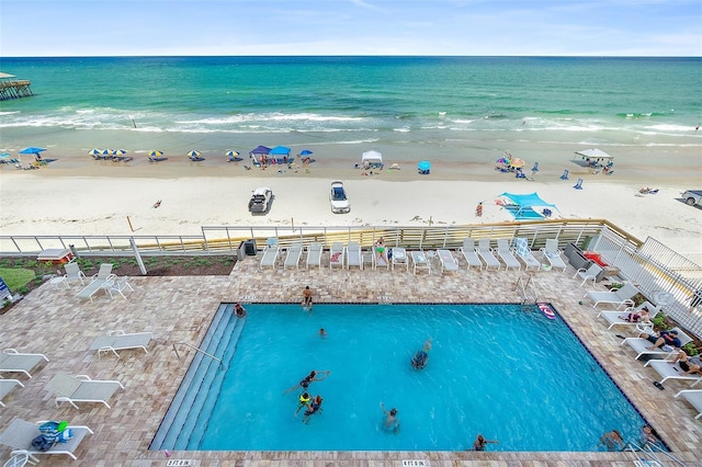 exterior space featuring a view of the beach and a water view