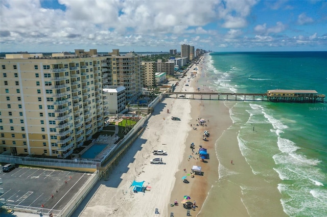 birds eye view of property featuring a view of the beach and a water view