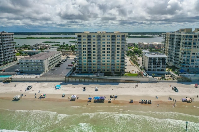 bird's eye view with a water view and a view of the beach