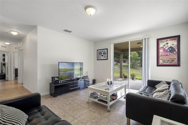 tiled living room with a textured ceiling