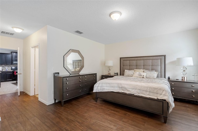 bedroom featuring dark wood-type flooring