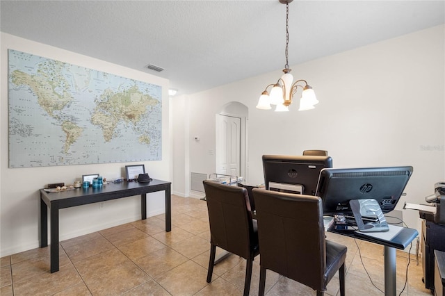 dining room featuring light tile patterned flooring and an inviting chandelier