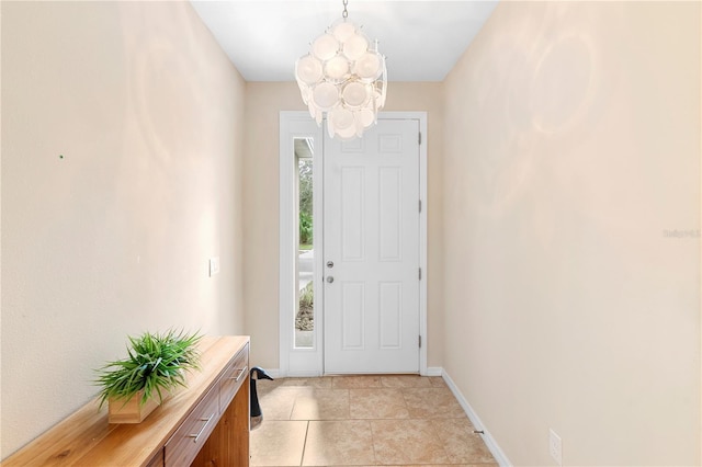 entryway featuring light tile patterned floors and an inviting chandelier