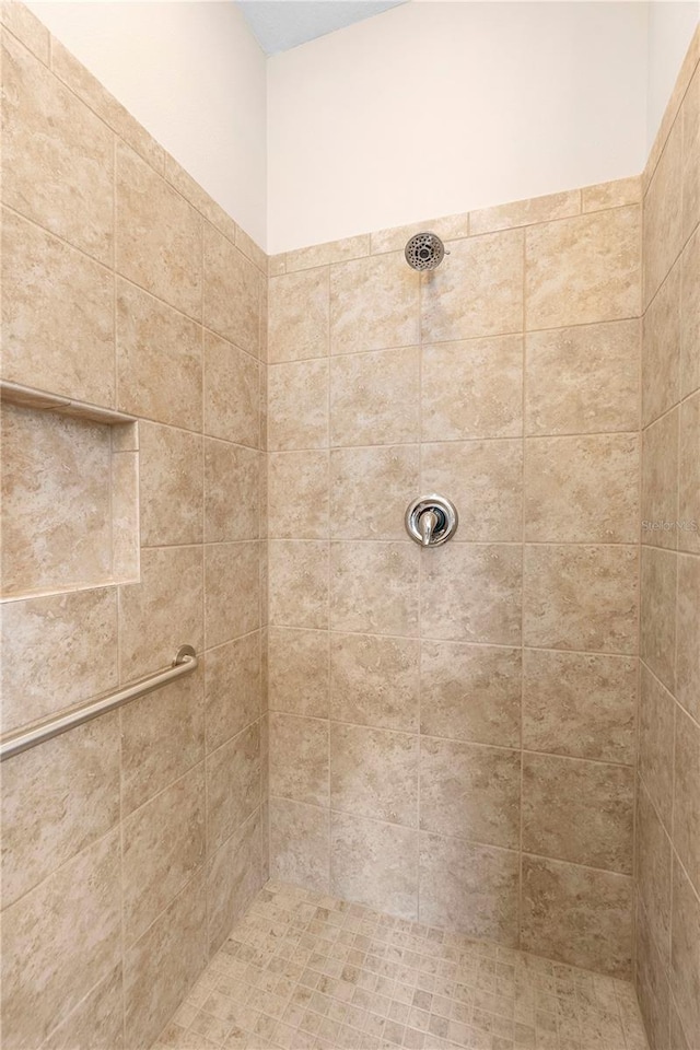 bathroom with a tile shower