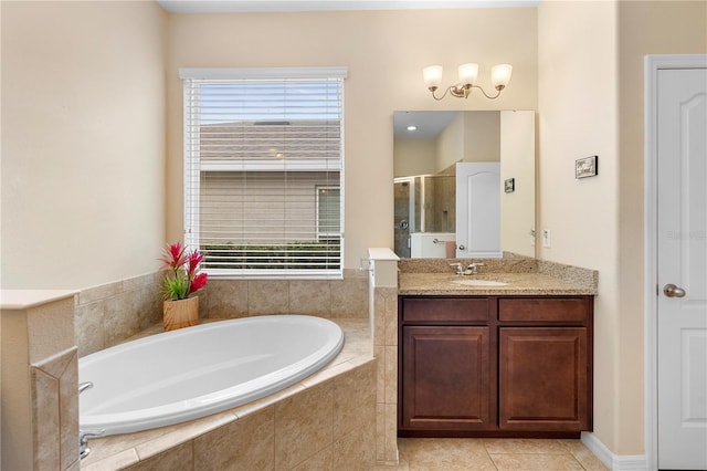 bathroom with tile patterned flooring, vanity, separate shower and tub, and a wealth of natural light