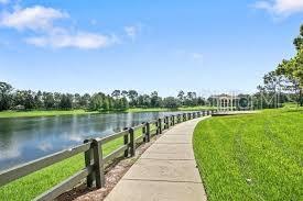 exterior space featuring a lawn and a water view