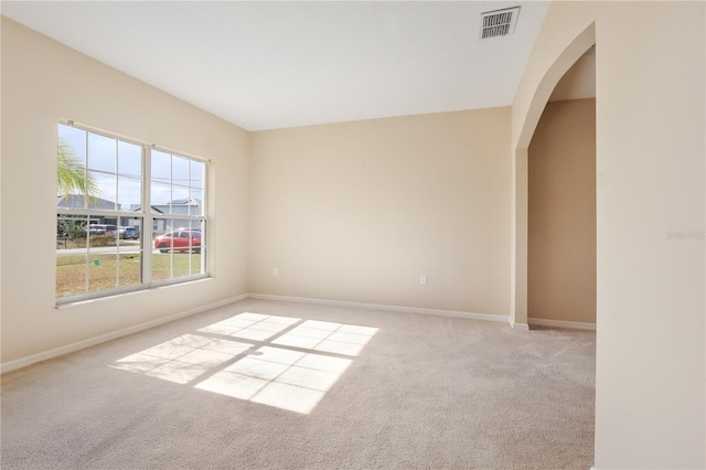 empty room featuring light carpet