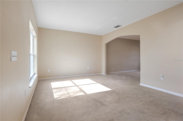 empty room featuring light carpet