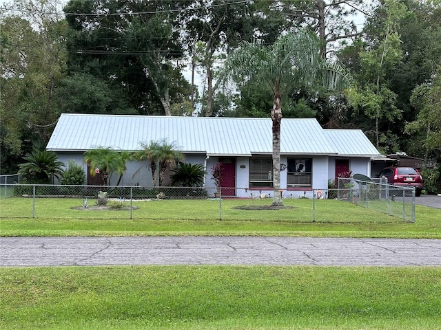 ranch-style home featuring a front yard