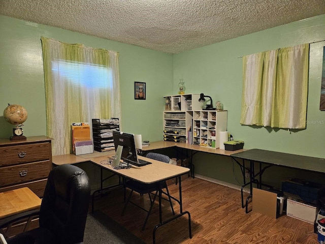 office space with wood-type flooring and a textured ceiling