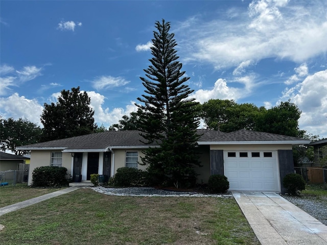 ranch-style home featuring a garage and a front lawn