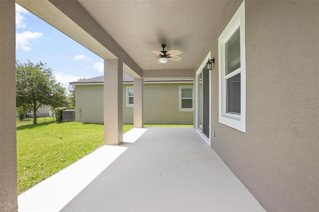 view of patio / terrace with ceiling fan and central AC