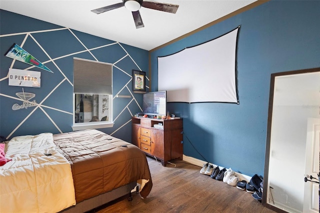 bedroom featuring hardwood / wood-style floors and ceiling fan