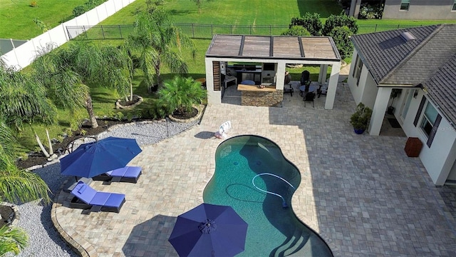 view of pool featuring a gazebo, a patio area, and an outdoor fireplace