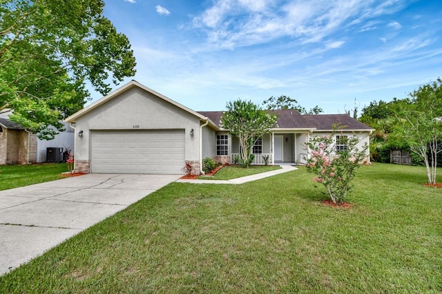 single story home featuring central AC unit, a garage, and a front lawn