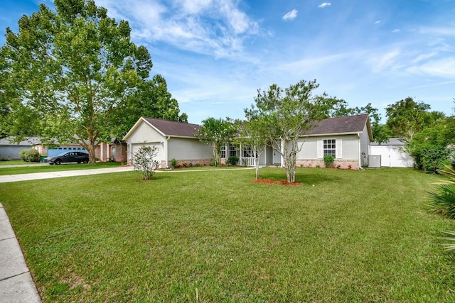 ranch-style home with a garage and a front lawn