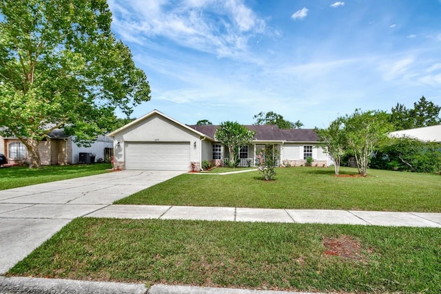 ranch-style house featuring a front yard and a garage