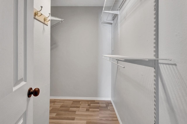 spacious closet with light wood-type flooring