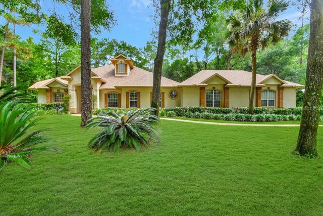 single story home with a front yard