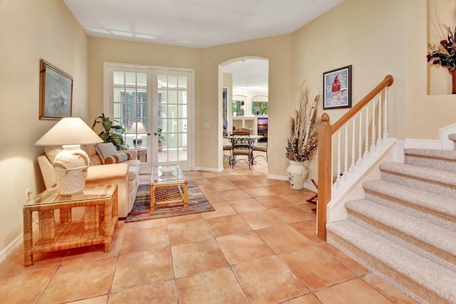 interior space featuring french doors and light tile floors