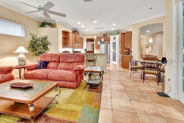 living room featuring ornamental molding, ceiling fan, and light tile floors