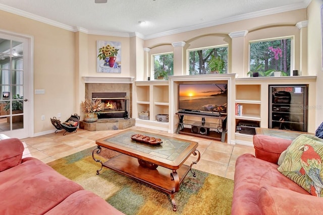 living room with tile flooring, a textured ceiling, a fireplace, and crown molding