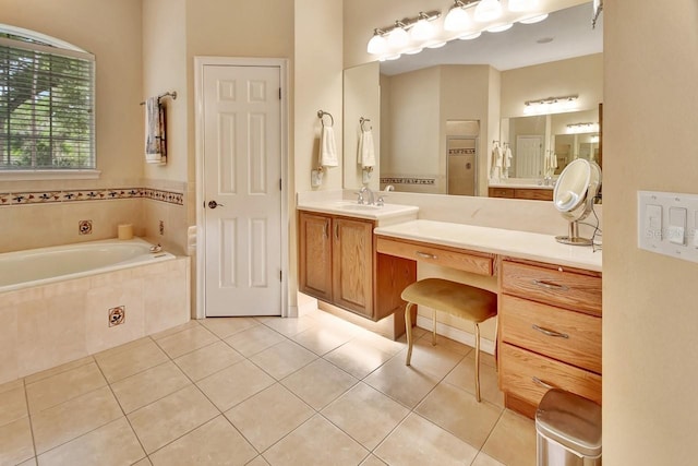 bathroom featuring tiled bath, vanity, and tile floors