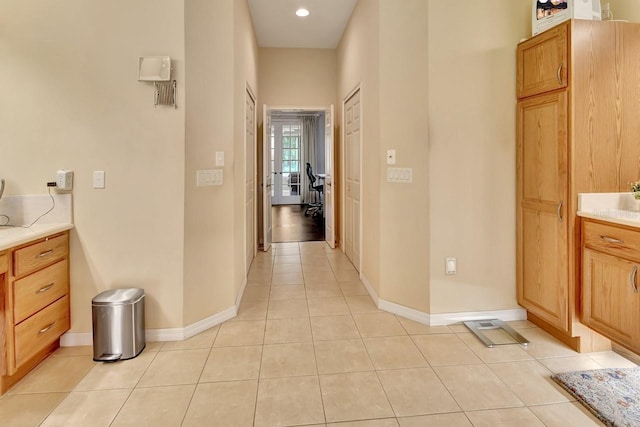 corridor with light tile flooring